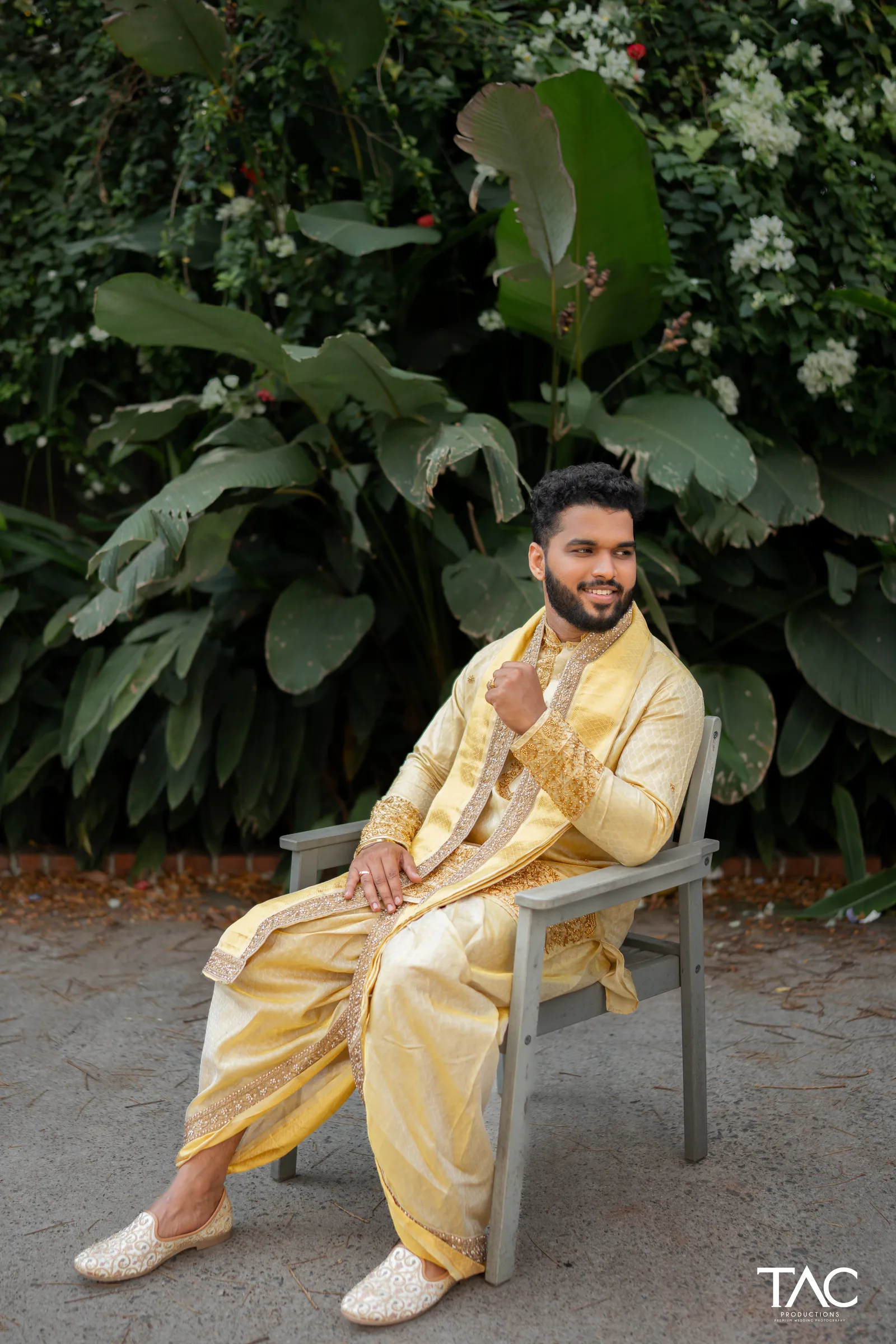 Groom portrait in gold silk against tropical greenery, UVA Meridian Bay Resort, Kundapura